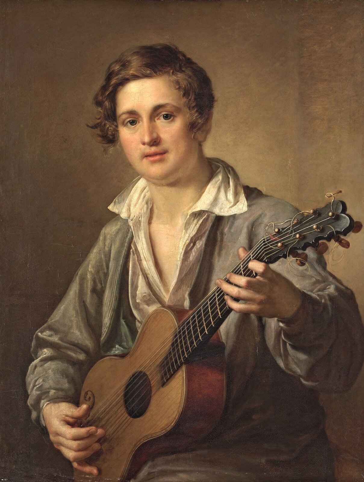 Vasily Tropinin. The Guitarist — a young musician playing the guitar